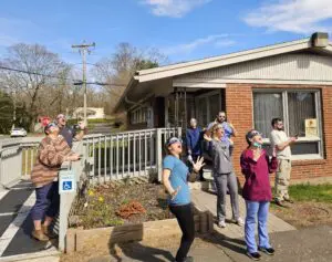 People watch solar eclipse with glasses.